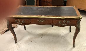 A circa 1900 French kingwood and brass embellished bureau plat in the Louis XV taste,