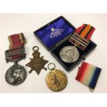 A collection of medals comprising a Victorian South Africa medal with bars for Transvaal,