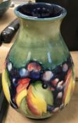 A William Moorcroft baluster shaped vase, leaf and berry pattern,