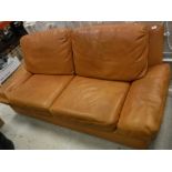 A Burov orange leather upholstered sofa,