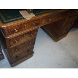 A Victorian walnut double pedestal desk,