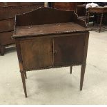 A 19th Century mahogany night table with cupboard above drawer on square moulded supports united by