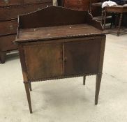 A 19th Century mahogany night table with cupboard above drawer on square moulded supports united by