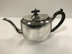 A Victorian silver teapot of oval form,