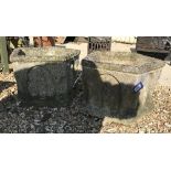 A pair of 20th Century ecclesiastical style composite stone planters of pentagonal form with