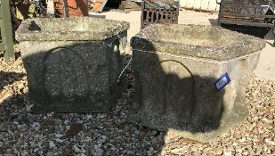 A pair of 20th Century ecclesiastical style composite stone planters of pentagonal form with