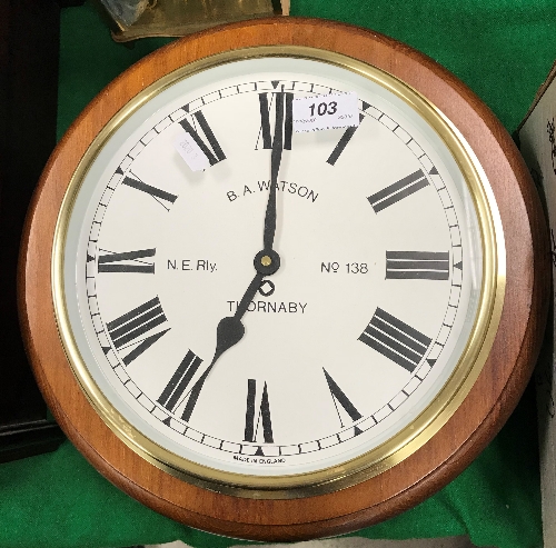 A modern pine mounted battery operated wall clock, the dial inscribed "B.A Watson N.E Rly No.