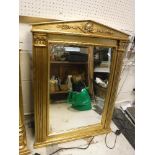 A pair of modern Empire style gilt framed wall mirrors of arched architectural form,