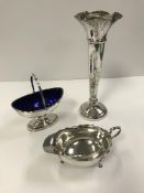 An Edwardian silver boat-shaped pedestal swing-handled sweetmeat dish with blue glass liner (by