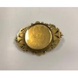 A George IV 1826 gold plated sixpence, housed in a yellow metal pierced frame as a brooch,