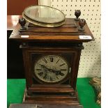 A 19th Century German walnut cased eight day mantel clock with silvered dial and Roman numerals,