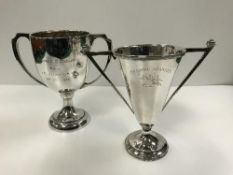 A twin-handled trophy cup in the Art Deco style,