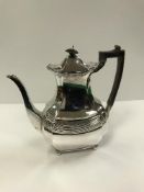 A Victorian silver coffee pot with reeded central band and acanthus decorated canted corners (by