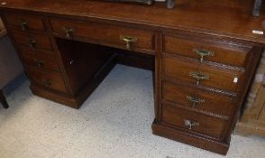 A circa 1900 walnut double pedestal desk by Maple & Co.