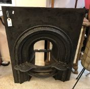 A 19th Century cast iron bedroom fireplace with integral kettle stands, 96.