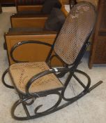 A pair of ebonised and caned bentwood rocking armchairs, after the original design by Michel Thonet,