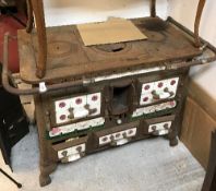 A French enamel kitchen range with tiled decoration