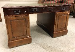 A modern reproduction mahogany double pedestal partners' desk,