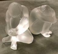 A Lalique figure of a nude clutching their knees, 5.