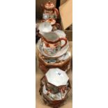 A extensive Japanese eggshell tea set including teapot, lidded sugar bowl, milk jug,