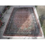 A Persian silk carpet,