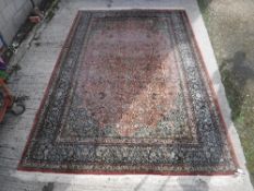 A Persian silk carpet,