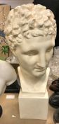 A 20th Century painted plaster bust of a Classical male figure on an integral block base,