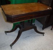 A George III mahogany tea table, the top rosewood strung and with reeded edge,