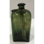 An 18th century four sided green glass bottle with seal to shoulder 18.5 cm high x 9 cm x 7.