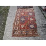 A Caucasian carpet section of red, blue and yellow colour approx.