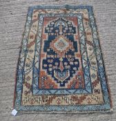 An Heriz rug,