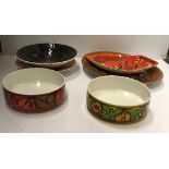 A collection of Poole pottery bowls, platters, etc.