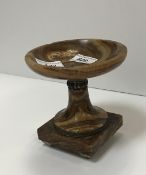 A brown onyx urn with silvered metal emb