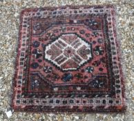 A Shiraz rug, the central panel set with