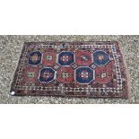 A Kazak rug, the central panel set with