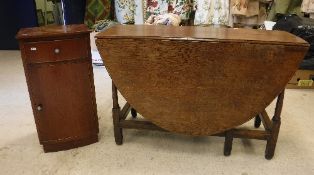 A 19th Century oak oval gate leg drop le