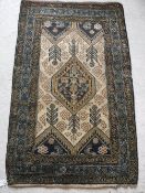 A Caucasian rug with centre medallion on