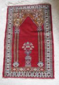 A Bokhara rug the central panel set with