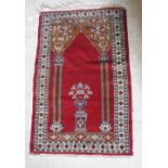 A Bokhara rug the central panel set with