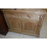 A modern Continental pine side cabinet,