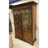 An Edwardian mahogany and inlaid display