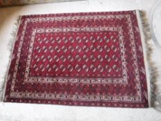 A Bokhara rug with repeating elephant fo