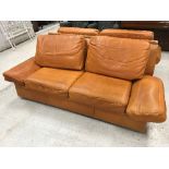 A Burov orange leather upholstered sofa,