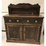 A carved oak cupboard in the 17th Centur