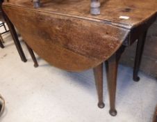 A 19th Century oak dining table, the ova