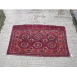 A Bokhara Juval rug, the main panel set