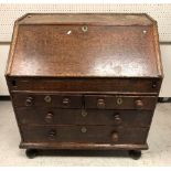 A 19th Century mahogany bureau, the plai