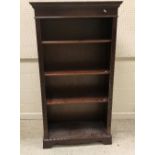 A modern mahogany bookcase with three ad