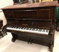 An early 20th Century rosewood cased upright piano,