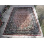 A Persian silk carpet, the central panel